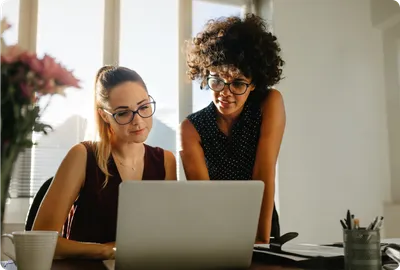 Stock - 2 women with laptop